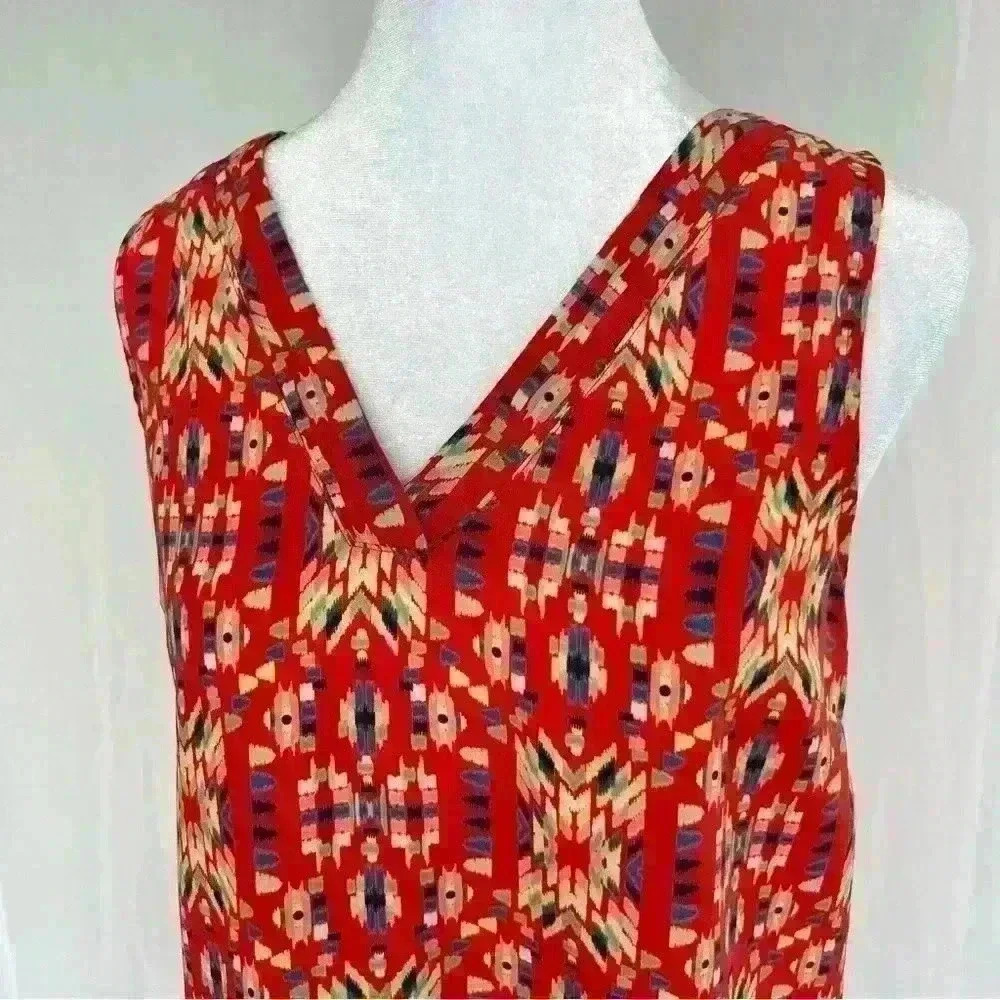 Skies Are Blue Aztec print top with fun back detail.